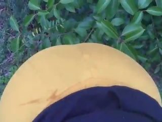 Ebony chick sucks on penis outside of the park